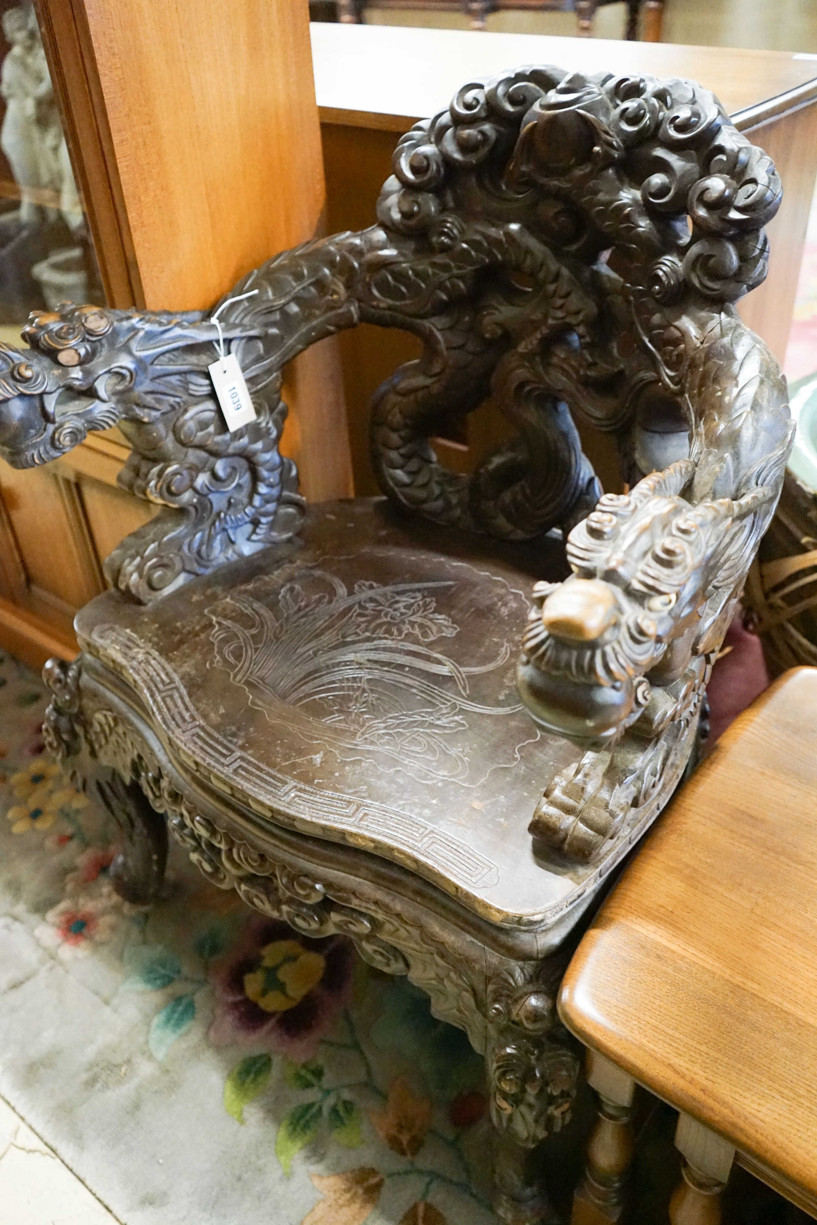 A Chinese carved hardwood 'dragon' elbow chair, width 68cm, depth 47cm, height 88cm